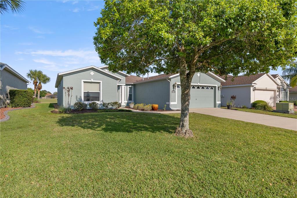 15813 Southwest 16th Avenue Road Ocala, FL 34473 - Photo 3 of 33 a front view of a house with a yard