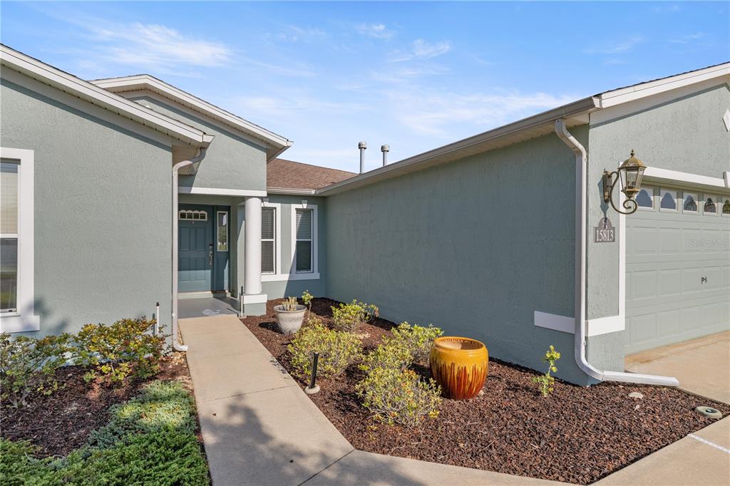 15813 Southwest 16th Avenue Road Ocala, FL 34473 - Photo 8 of 33 a front view of a house with entryway