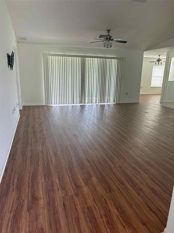 15813 Southwest 16th Avenue Road Ocala, FL 34473 - Photo 9 of 33 wooden floor in an empty room with a window