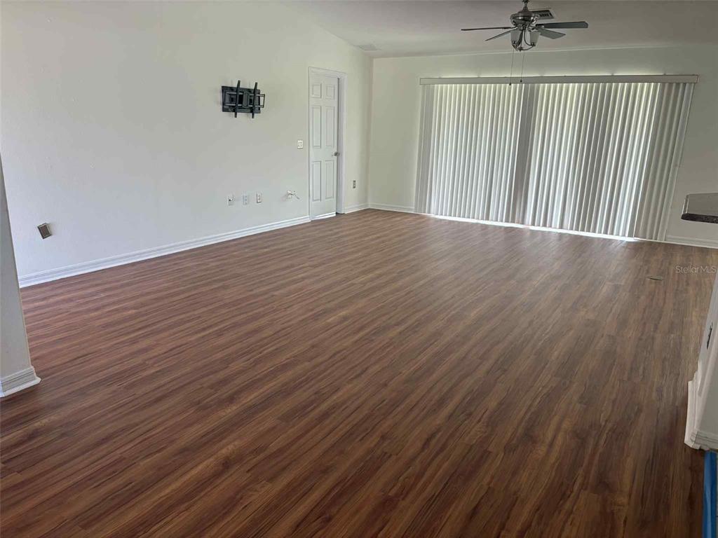 15813 Southwest 16th Avenue Road Ocala, FL 34473 - Photo 10 of 33 wooden floor in a hall with a window