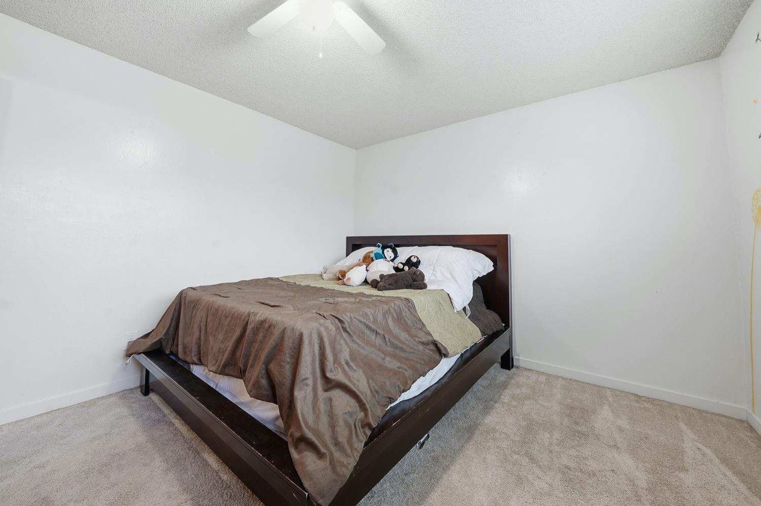 27 Omaha Court Sacramento, CA 95823 - Photo 26 of 43 a bed sitting in a bedroom next to a window