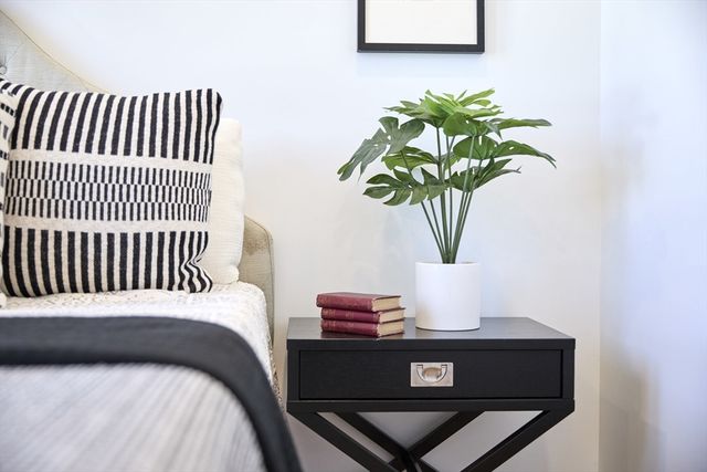 a front view of a building and car parked