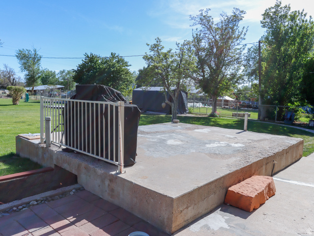 155 West Center Street Fillmore, UT 84631 - Photo 64 of 86 Expansive concrete patio area with a white metal railing