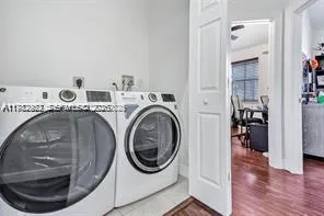 a utility room with dryer and washer