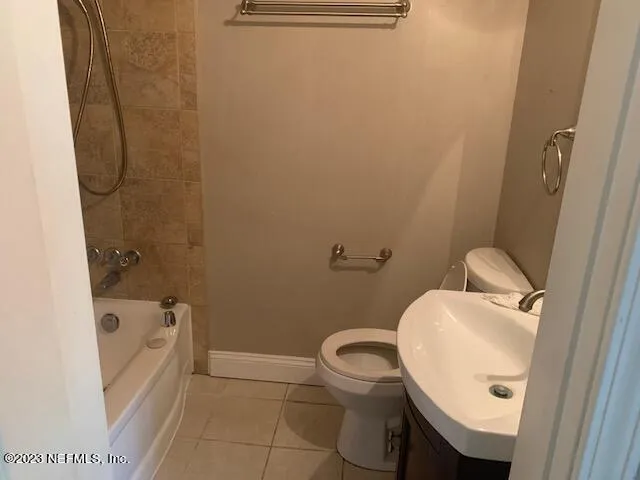 a bathroom with a sink a toilet and bathtub
