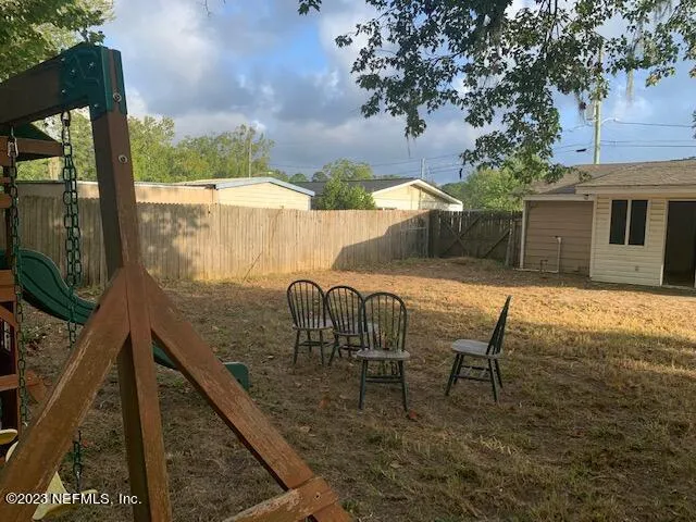 a view of a balcony with furniture