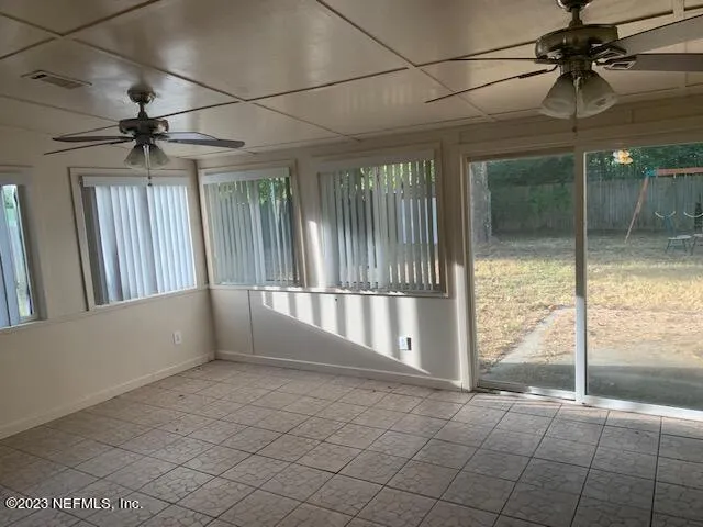 a view of an empty room and window