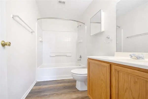 a bathroom with a sink a toilet and a bathtub