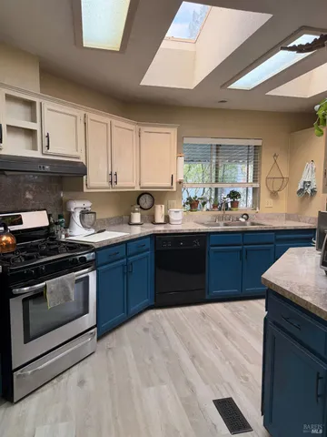 a kitchen with a sink and cabinets