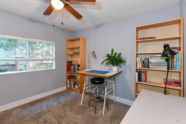 a white toilet sitting next to a bathroom sink