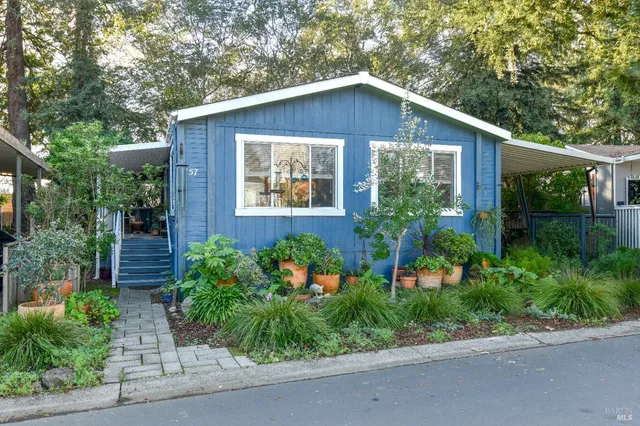 a house view with a sitting space garden view