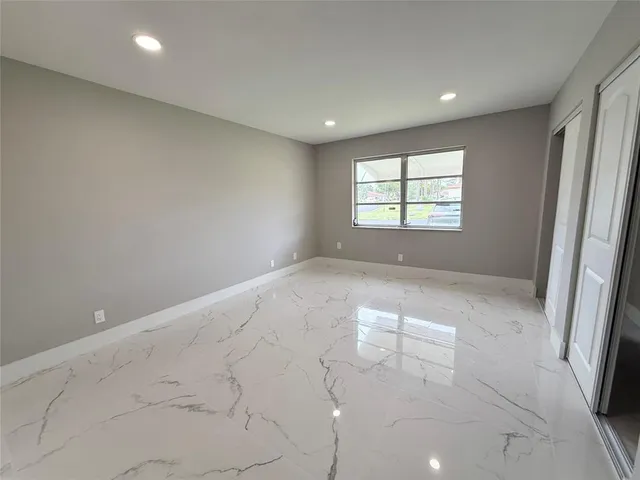 a bedroom with a bed and a table in it