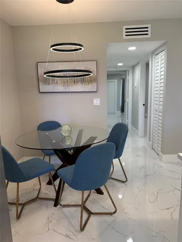 a view of a livingroom with furniture and workspace