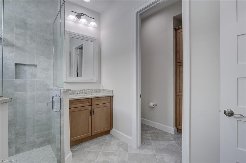 6297 Antigua Way Naples, FL 34113 - Photo 18 of 43 a view of a hallway to rooms