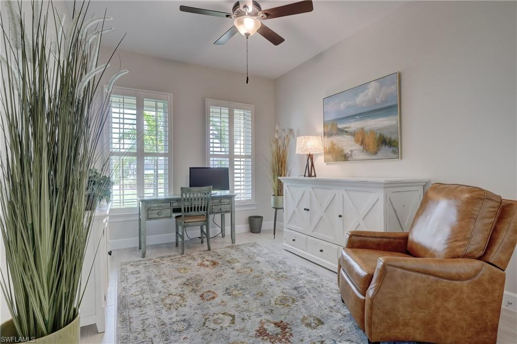 6297 Antigua Way Naples, FL 34113 - Photo 22 of 43 a work room with furniture and a large window