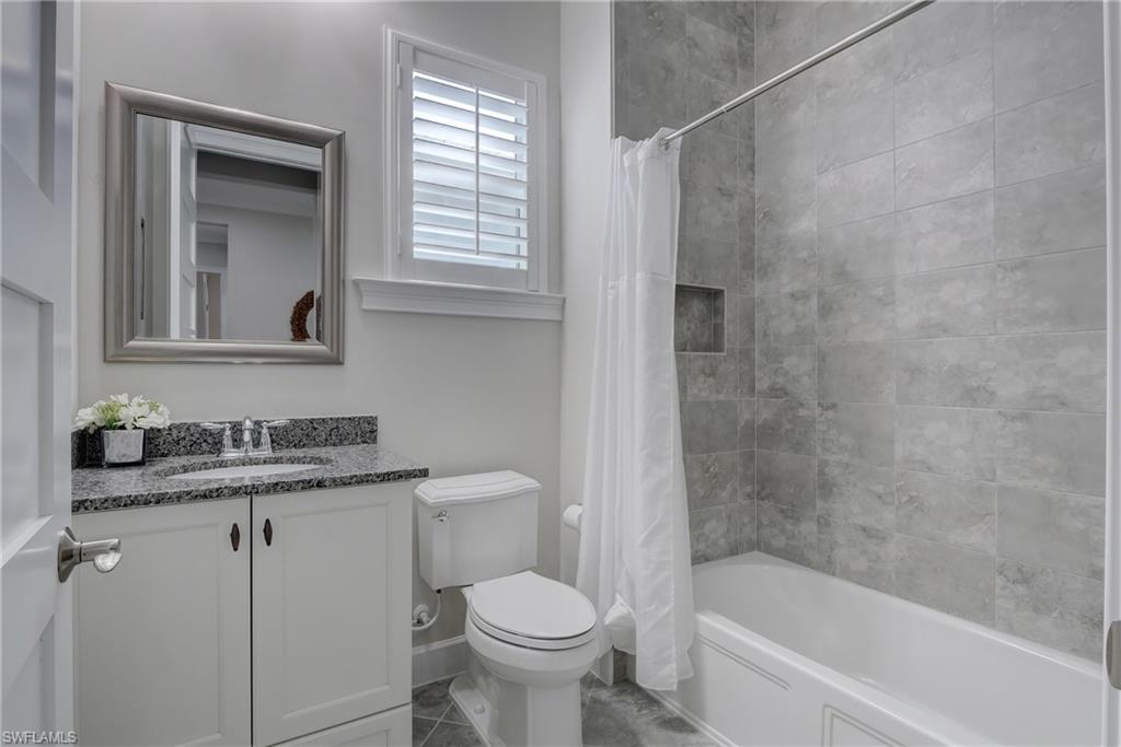 6297 Antigua Way Naples, FL 34113 - Photo 25 of 43 a bathroom with a sink toilet and shower