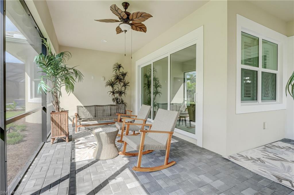 6297 Antigua Way Naples, FL 34113 - Photo 28 of 43 a dining room with furniture and window