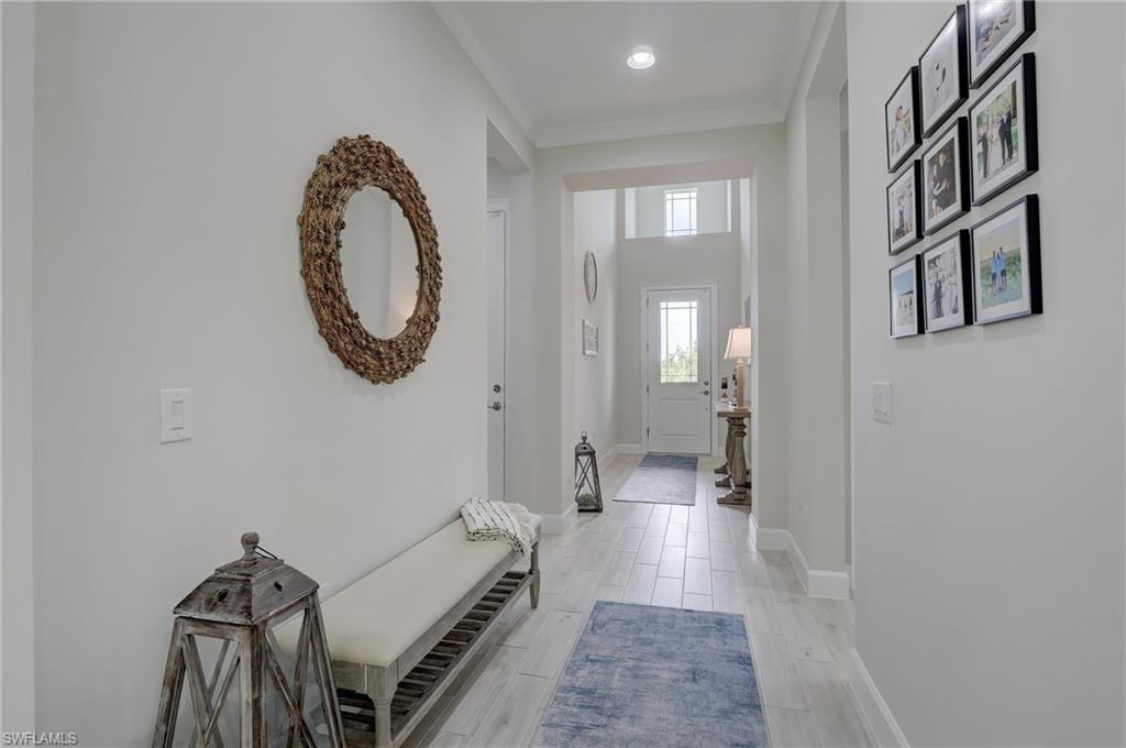 6297 Antigua Way Naples, FL 34113 - Photo 3 of 43 a view of a hallway with elevator