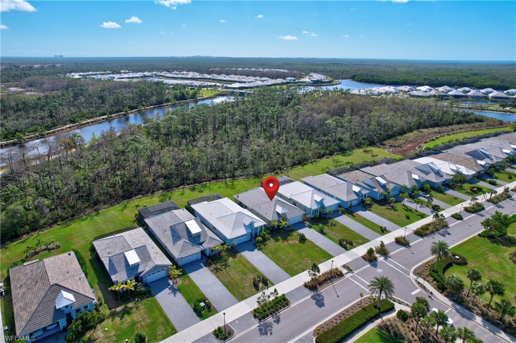 6297 Antigua Way Naples, FL 34113 - Photo 35 of 43 an aerial view of a house with a garden
