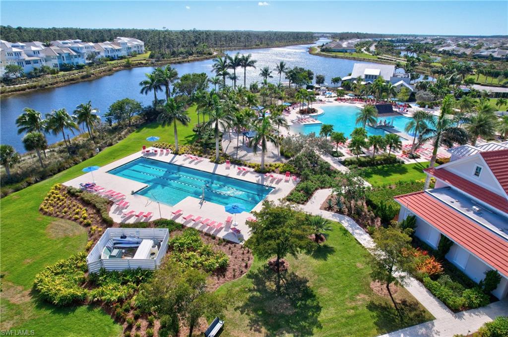 6297 Antigua Way Naples, FL 34113 - Photo 38 of 43 an aerial view of residential houses with outdoor space and river