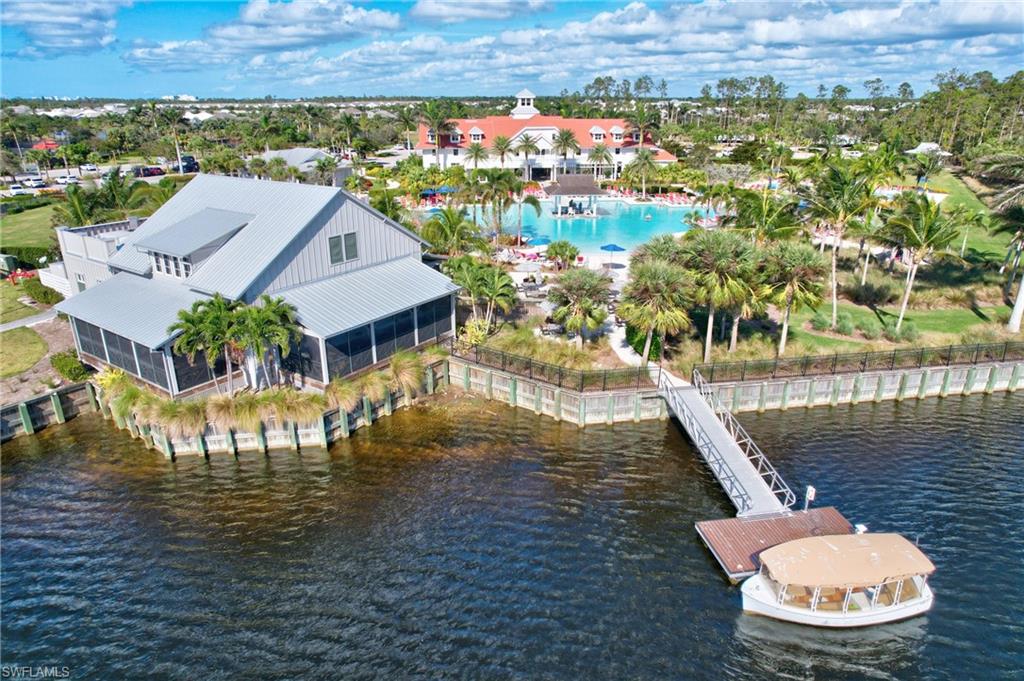 6297 Antigua Way Naples, FL 34113 - Photo 39 of 43 an aerial view of a house with outdoor space swimming pool and lake view
