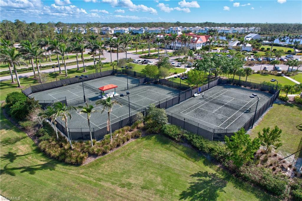 6297 Antigua Way Naples, FL 34113 - Photo 42 of 43 an aerial view of a house with a garden and lake view