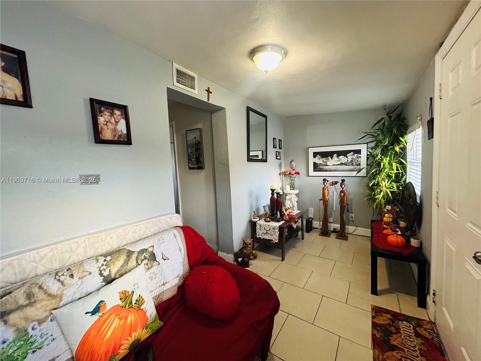 244 Southwest 36th Avenue Miami, FL 33135 - Photo 1 of 17 a bedroom with furniture and a couch