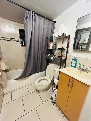 a bedroom with a bed and cabinets