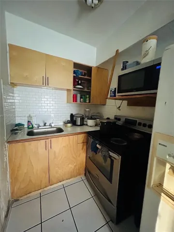 a bedroom with a bed and cabinets