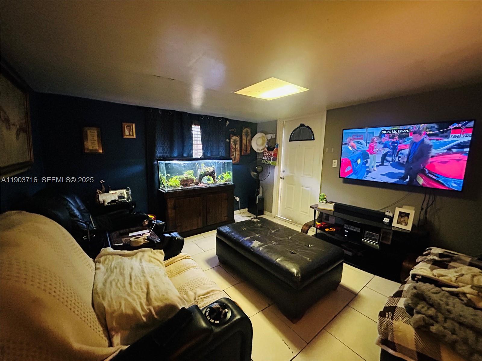 244 Southwest 36th Avenue Miami, FL 33135 - Photo 2 of 17 a living room with furniture and a flat screen tv