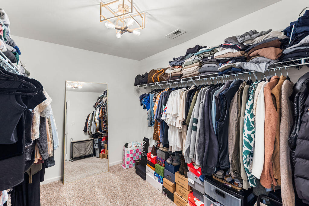 7900 West 105th Place Crown Point, IN 46307 - Photo 20 of 33 a view of walk in closet with clothes