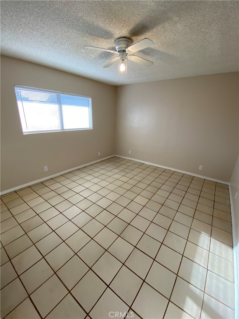 18746 Rock Springs Road Hesperia, CA 92345 - Photo 14 of 21 a view of an empty room and window