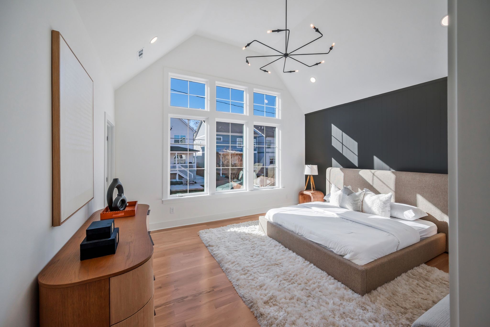 605 A American Road Nashville, TN 37209 - Photo 12 of 36 a bedroom with a large bed and a chandelier