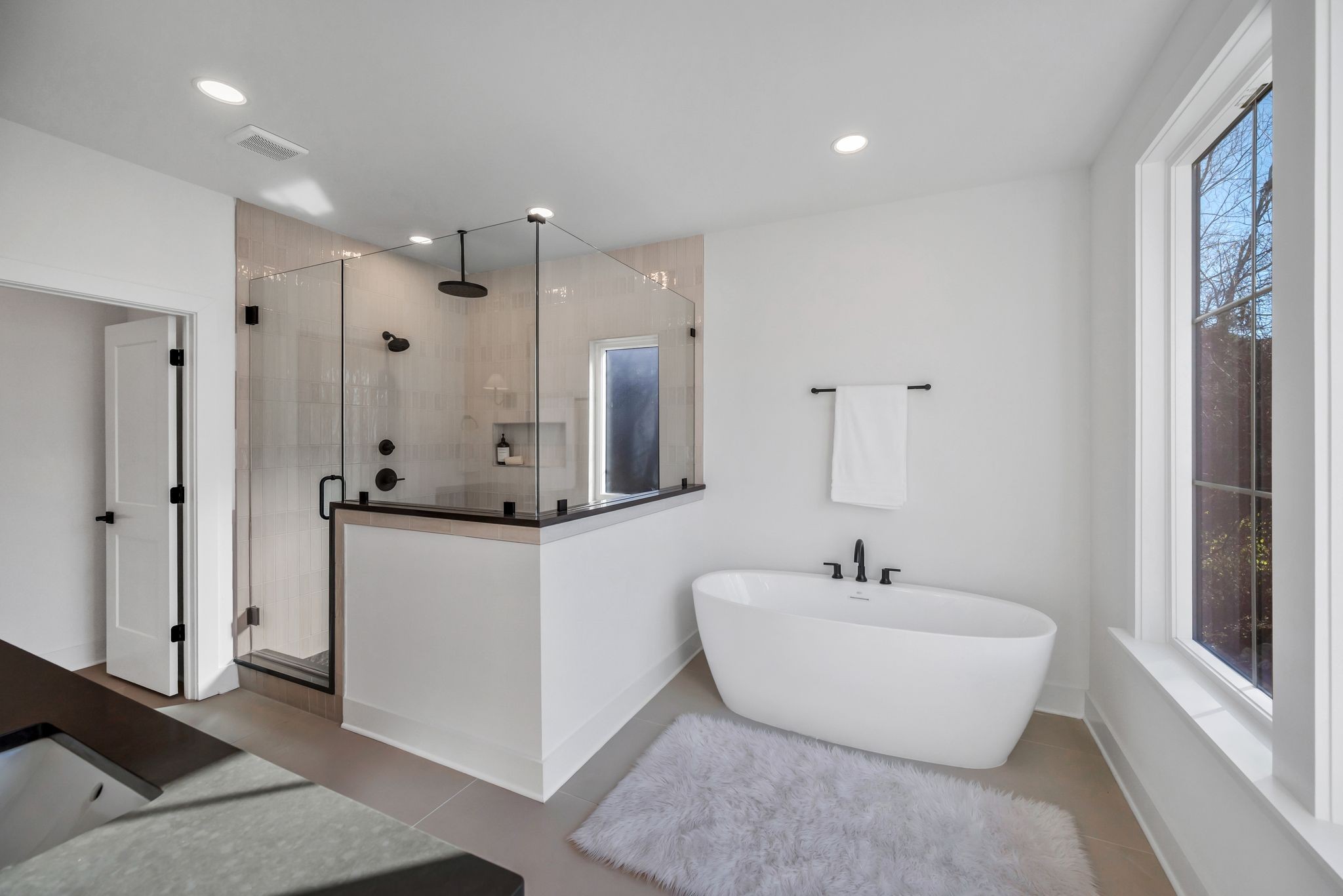 605 A American Road Nashville, TN 37209 - Photo 15 of 36 a bathroom with a double vanity sink mirror and shower