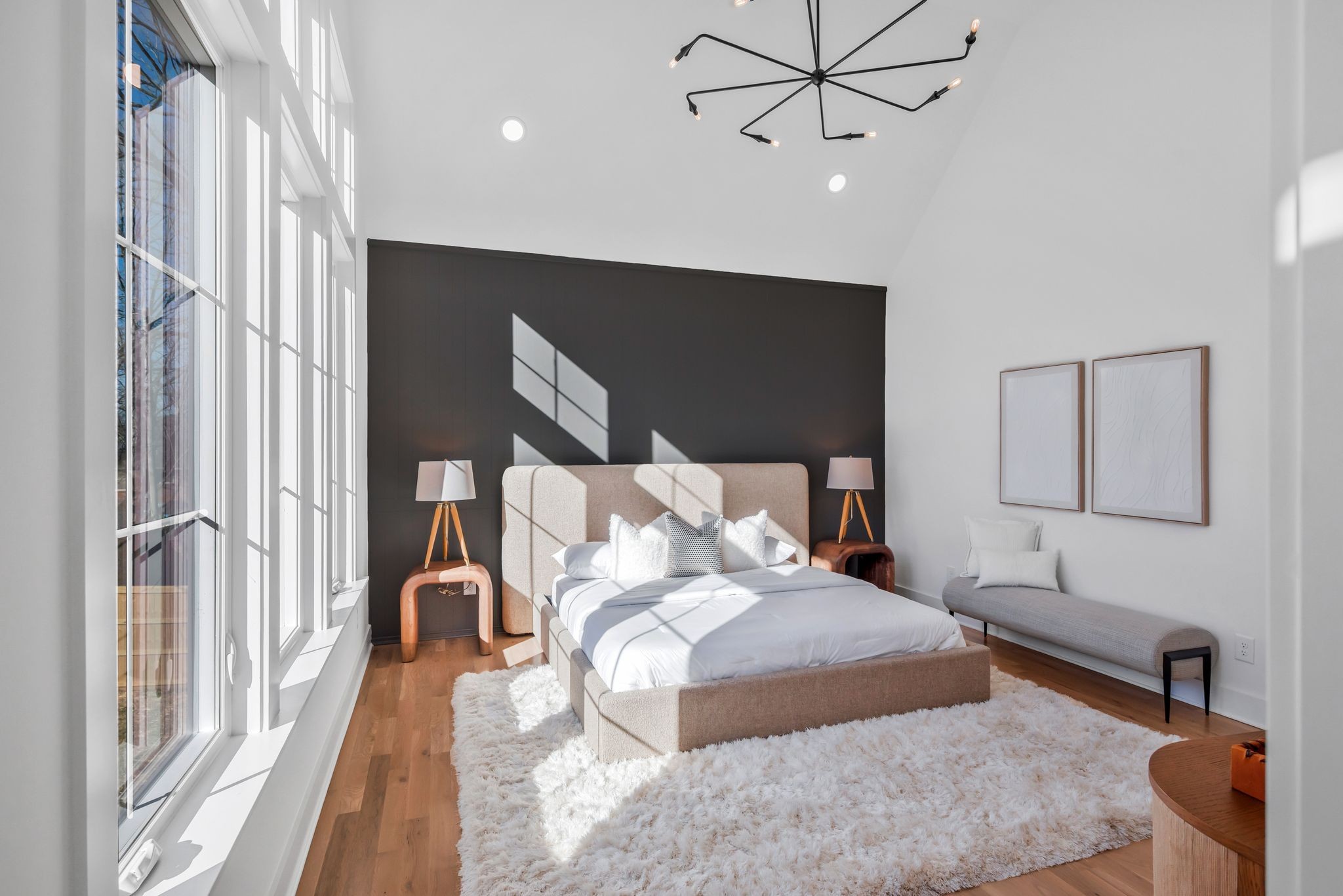605 A American Road Nashville, TN 37209 - Photo 17 of 36 a bedroom with a large bed and a chandelier