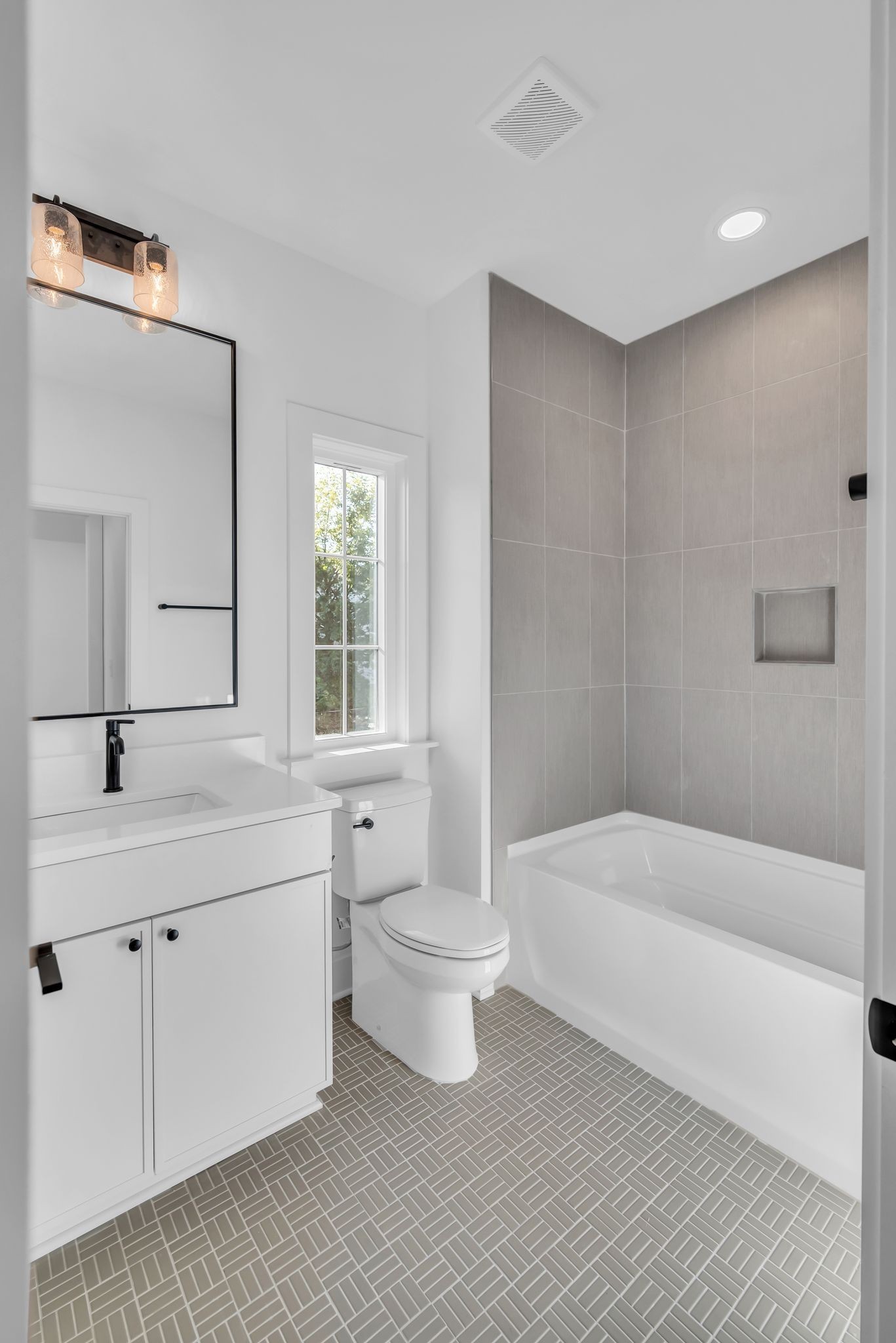 605 A American Road Nashville, TN 37209 - Photo 26 of 36 a bathroom with a bathtub sink mirror and toilet