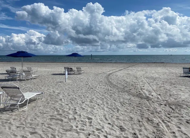 a view of a backyard with furniture