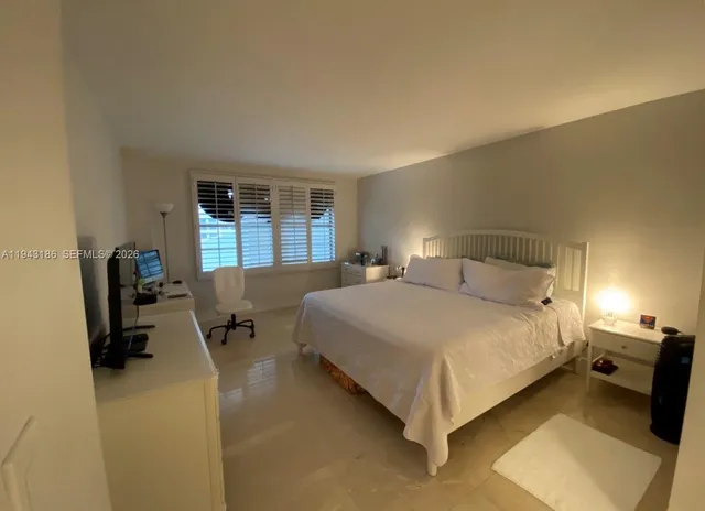 a bedroom with a bed and furniture