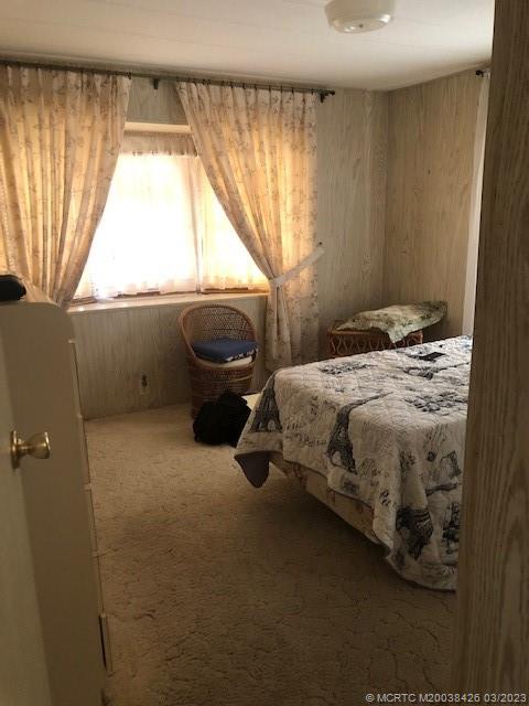 21 Los Lagos Road Port St. Lucie, FL 34952 - Photo 11 of 25 a bedroom with a bed and a window