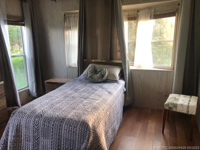 21 Los Lagos Road Port St. Lucie, FL 34952 - Photo 13 of 25 a bedroom with a bed and window