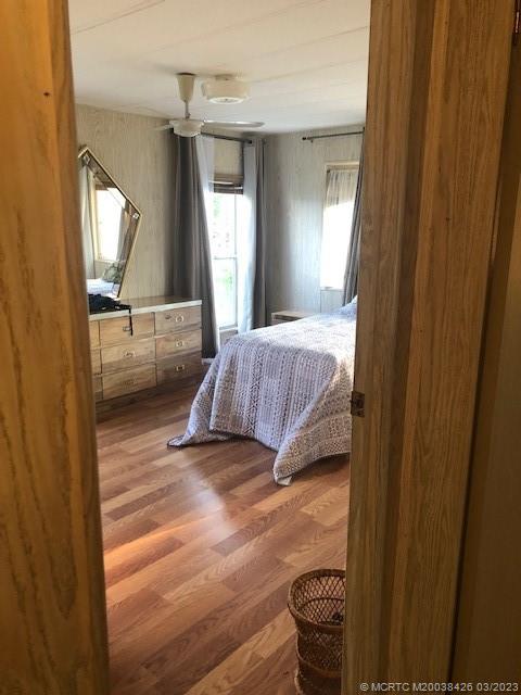 21 Los Lagos Road Port St. Lucie, FL 34952 - Photo 14 of 25 a bedroom with a bed and a window