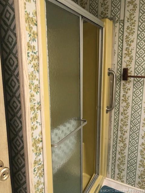 21 Los Lagos Road Port St. Lucie, FL 34952 - Photo 18 of 25 a bathroom with a shower and a sink