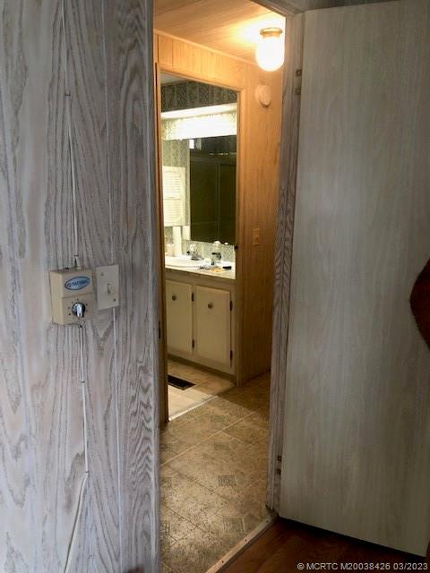 21 Los Lagos Road Port St. Lucie, FL 34952 - Photo 19 of 25 a bathroom with a granite countertop sink a mirror and a bathtub