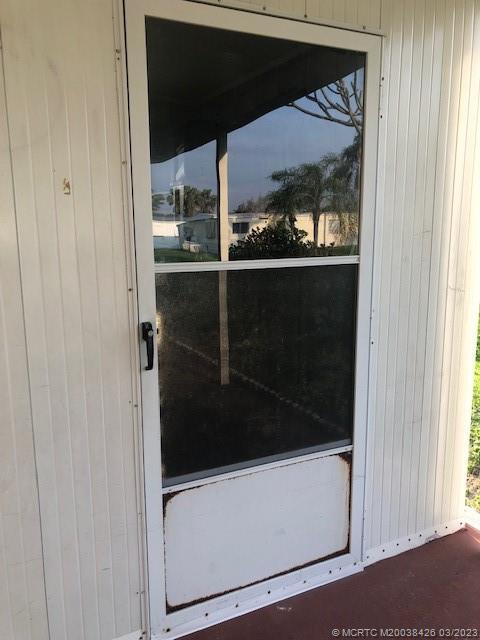 21 Los Lagos Road Port St. Lucie, FL 34952 - Photo 23 of 25 a microwave oven on a refrigerator