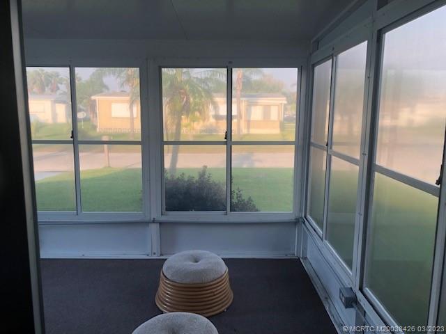 21 Los Lagos Road Port St. Lucie, FL 34952 - Photo 25 of 25 a room with furniture and a large window