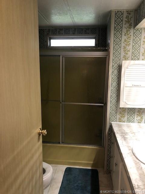 21 Los Lagos Road Port St. Lucie, FL 34952 - Photo 9 of 25 a bathroom with a bathtub and shower