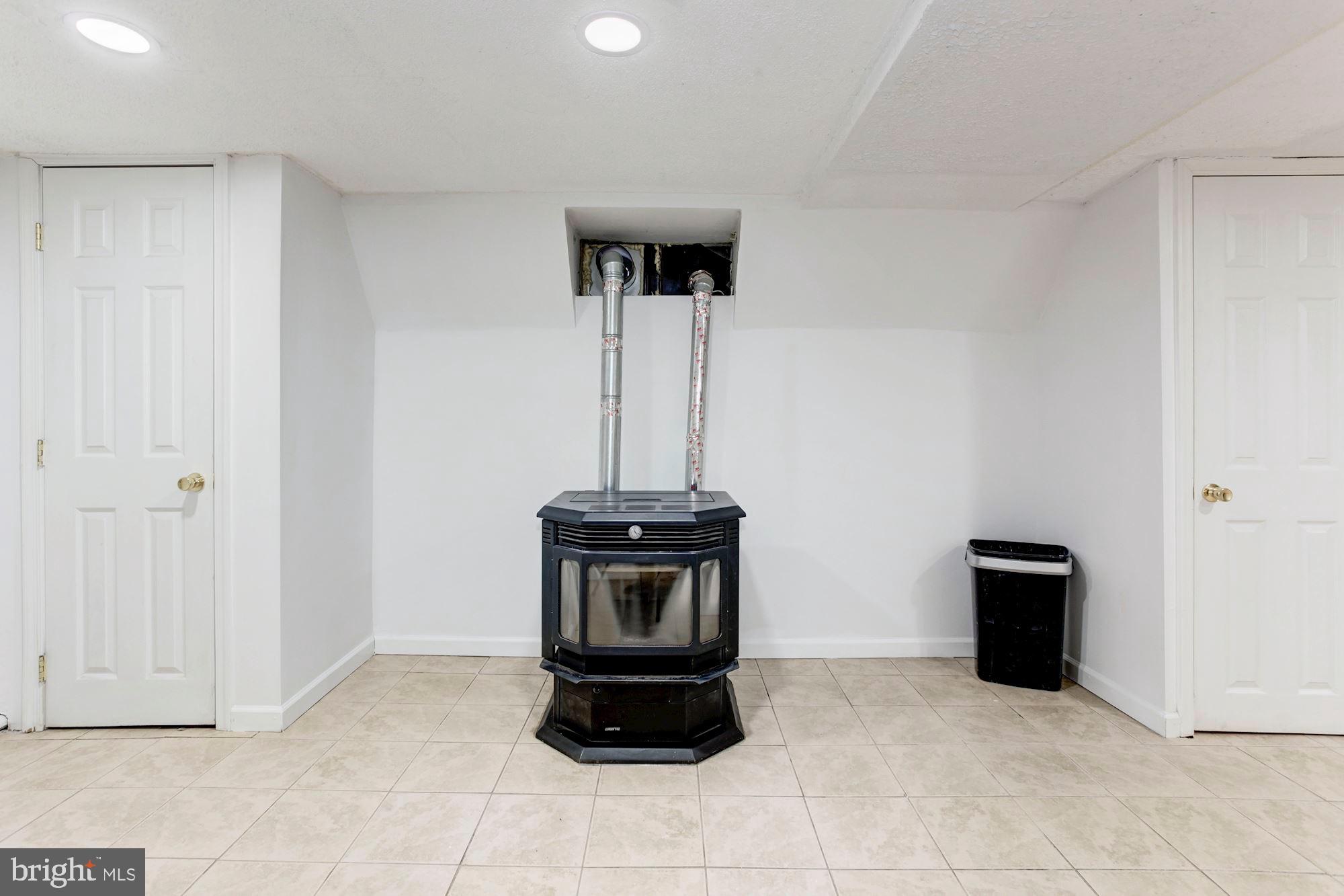 901 Ficklen Road Fredericksburg, VA 22405 - Photo 26 of 38 PELLET Stove in the basement.