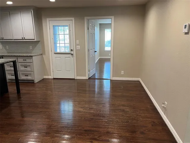 a view of a livingroom with wooden floor