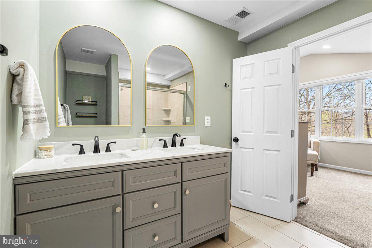 2816 Ballenger Creek Pike Frederick, MD 21703 - Photo 18 of 38 a bathroom with 2 sink and a mirror