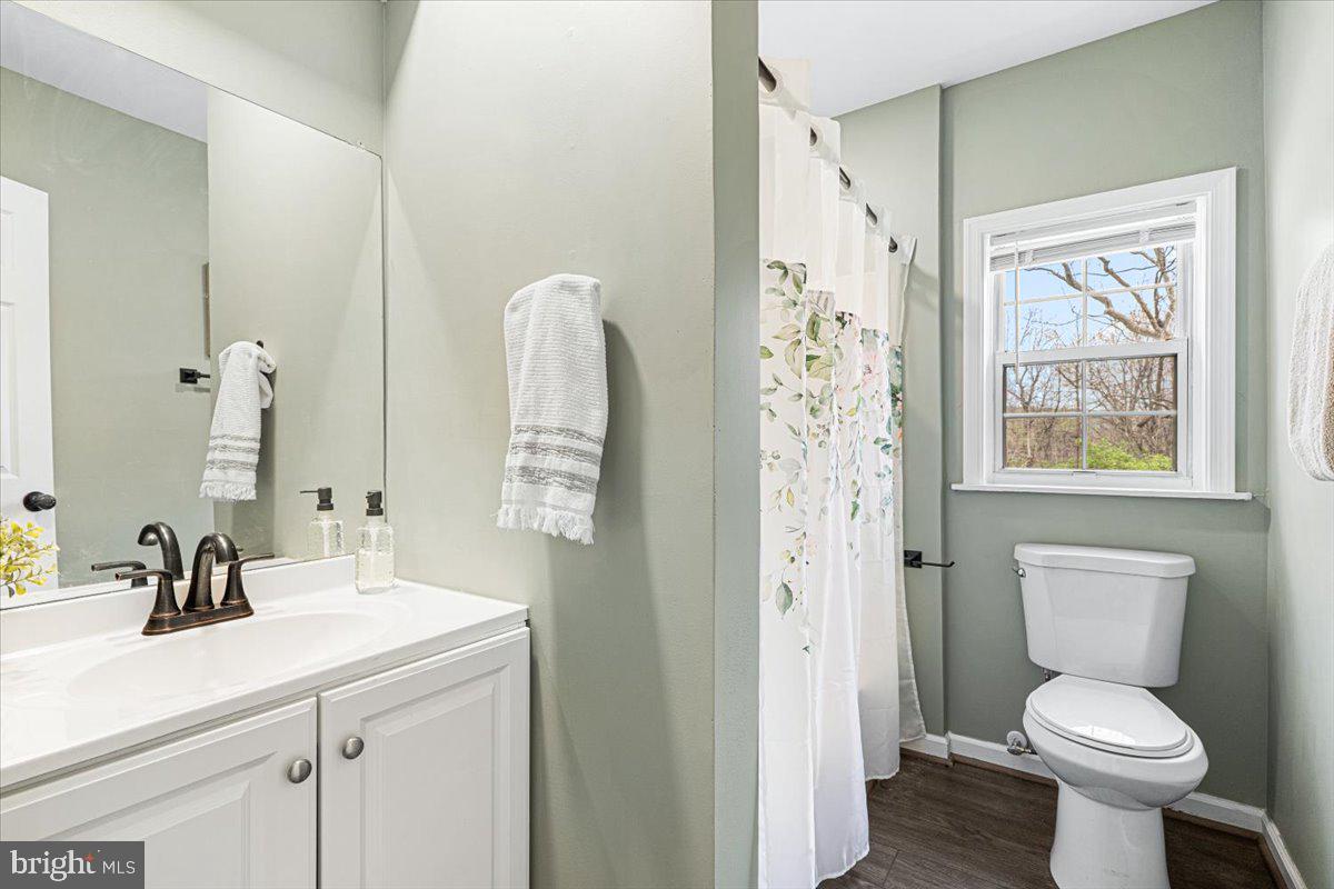 2816 Ballenger Creek Pike Frederick, MD 21703 - Photo 20 of 38 a bathroom with a sink toilet and shower